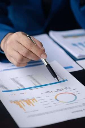 business-men-are-looking-at-the-company-s-financia-2023-03-08-21-10-45-utc-min