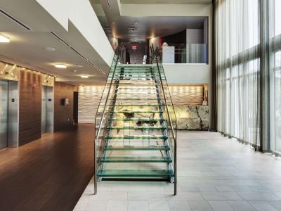 glass-staircase-in-hotel-lobby-2022-03-04-02-21-13-utc-min